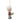 Christmas ornament of a person with a white hat and red coat holding a gift, on a white background.