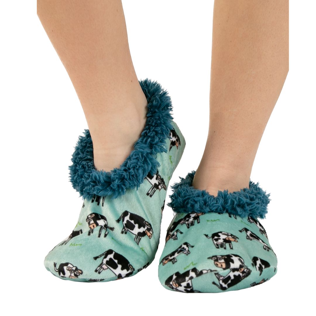 Moody in the Morning blue fuzzy feet slippers with Holstein cow pattern, fleecy lining, and non-skid sole, available in sizes S/M and L/XL