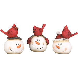 Snowman with red cardinal figurines in assorted styles. Made with resin and about 4.5 inches tall.