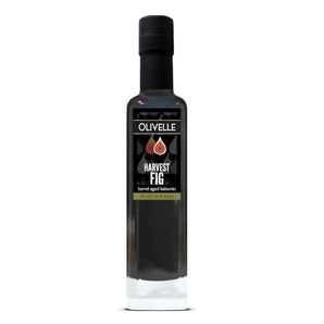 Bottle of Olivelle Harvest Fig olive oil on a white background