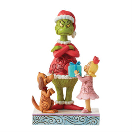 The Grumpy Grinch getting a present from Cindy Lou Who and Grinch's dog, Max. Jim Shore hand-painted collectible figurine. 