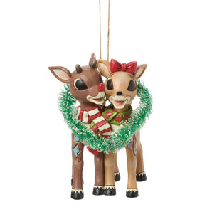 Jim Shore Rudolph Traditions ornament featuring Rudolph and Clarice inside a sisal heart wreath with entwined scarves and hand-painted folk-art details.