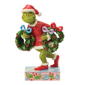 Jim Shore Grinch carrying multiple wreaths figurine
