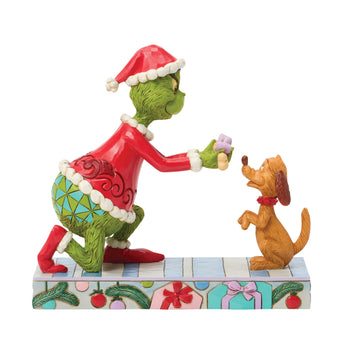 Jim Shore Grinch giving Max a bone figurine