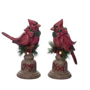Christmas Cardinals on a pedestal that lights up. 