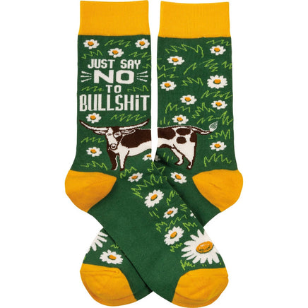 Just say no to bullshit green and yellow crew socks featuring black and white long-horned cow and daisy design.