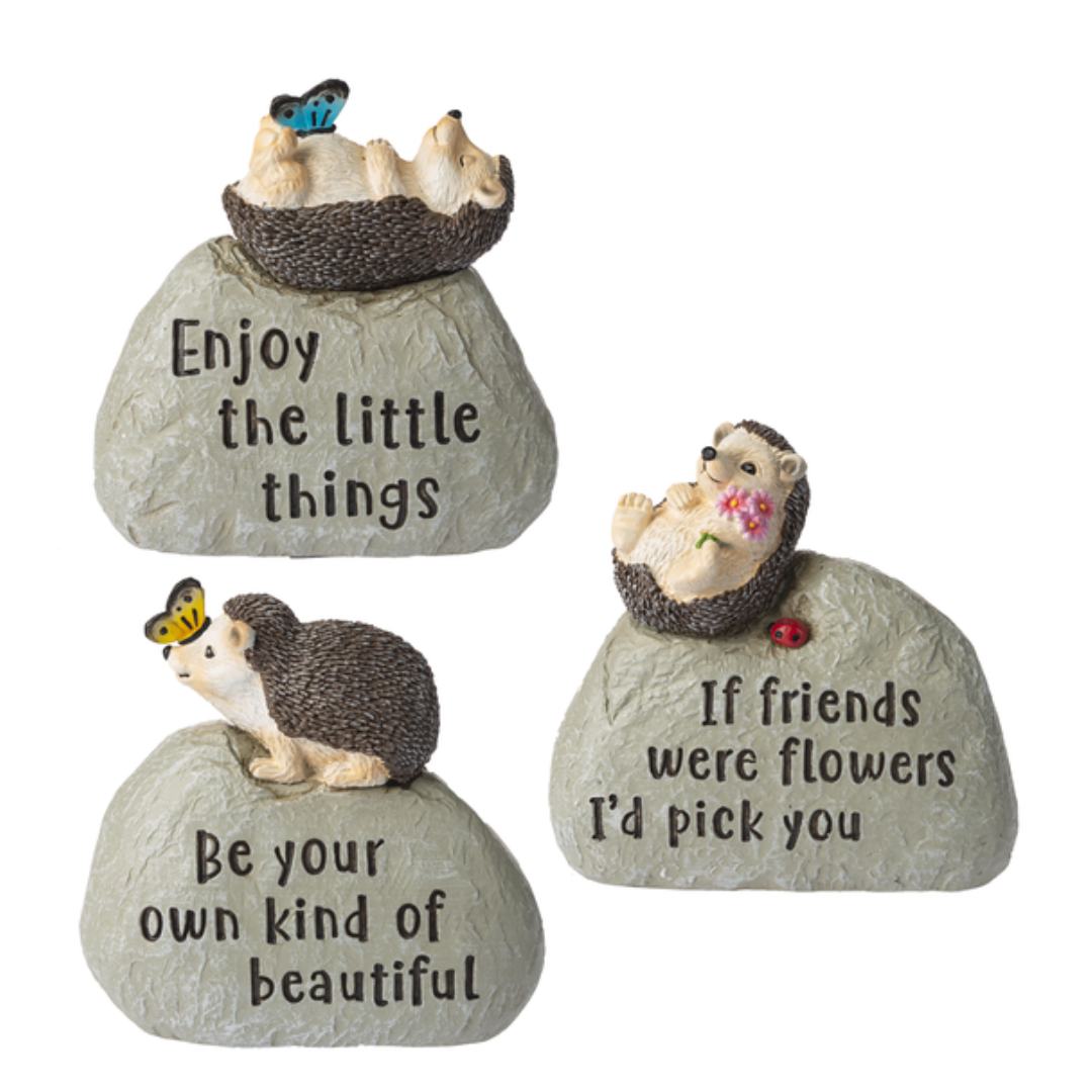 Baby Hedgehog Figurines on rocks with inspirational sayings
