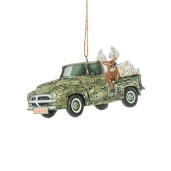 Decorative ornament of a camouflage truck with a deer on top, hanging against a white background.