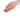 Hand holding a 12 days of kindness die with christmas designs on a white background