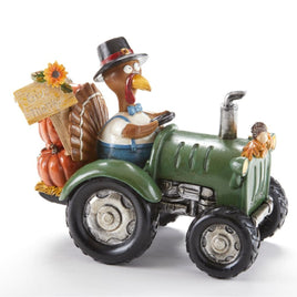 Turkey delivering the fall pumpkins in time for Thanksgiving. Give Thanks sign adorns this Thanksgiving Figurine