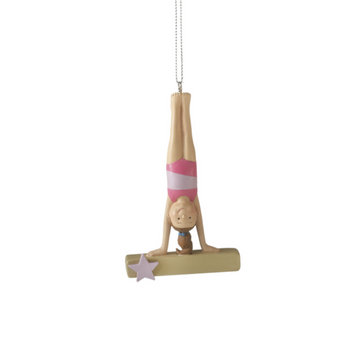 Gymnast Ornament in pink leotard performing beam poses with star accent