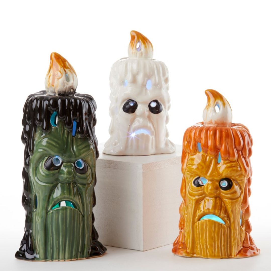 Halloween Monster Candles with LED lights, assorted colors and sizes.