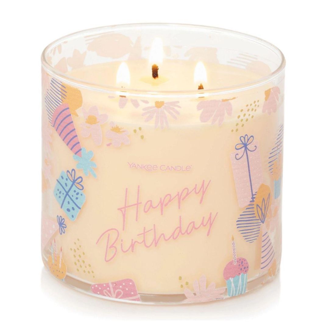 Happy Birthday labeled Vanilla Cupcake 3-Wick Candle in a decorative glass jar with embossed metal lid, emitting a rich vanilla and lemon scent