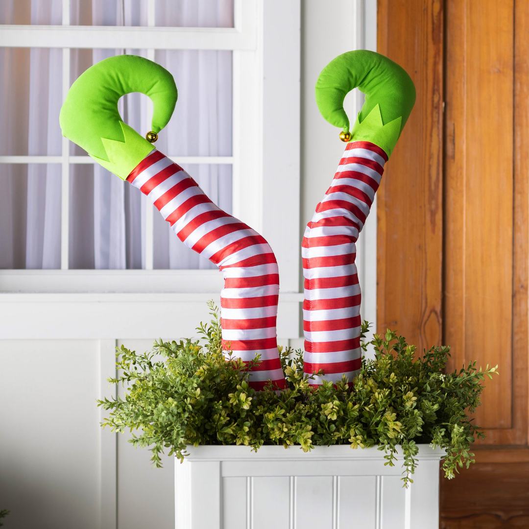 Holiday Elf Legs in Red and White Stripes with Green Slippers and bells on the tip of the toe set of 2 legs. Perfect for decorating your garden, tree, flower containers for the holiday season...