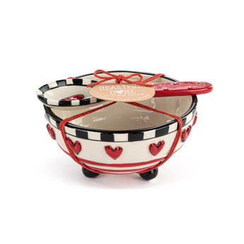 Holiday-themed stoneware candy dish with sculpted red hearts and black-and-white trim, tied with a red cord and matching spoon