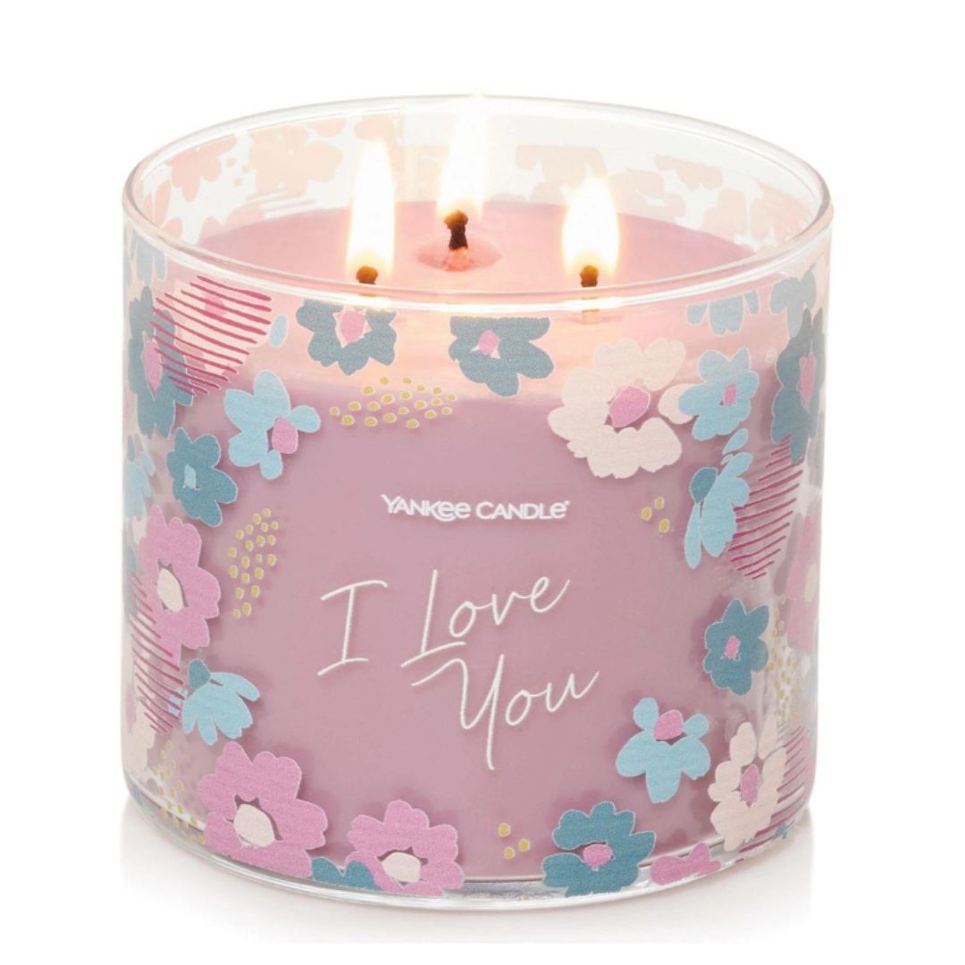 'I Love You' Wild Orchid 3-Wick Candle in a glass jar with a decorative tropical label and metal lid, ideal for romantic gifts and home fragrance.