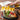 Drizzeling Maple Wood Smoked Bacon Infused Olive Oil over grilled vegetable 