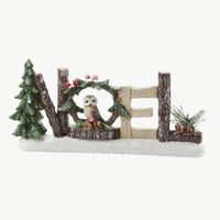 NOEL Christmas Woodland Centerpiece figurine with Christmas tree and logs with owl perched in the middle of the O in NOEL. Great for table top centerpiece or shelf decor.