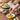 Photo of Parmesan and Asiago Dipper and Seasoning and bread dipping oil on wood table.