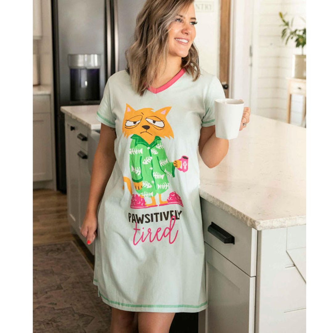 Women's Morning Mist Blue V-neck nightshirt with 'Pawsitively Tired' cat graphic, featuring pink slippers and coffee, made from 100% combed cotton
