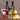 Bottle of Vine-Ripened Raspberry White Barrel Aged Balsamic and Sicilian Lemon Infused Olive Oil and a Shaker Bottle for mixing dressings and marinades with fruit in the background.