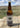 South Dakota Bounty Buffalo Bear Bread mix in a brown bottle on a wooden table out in the South Dakota praire.