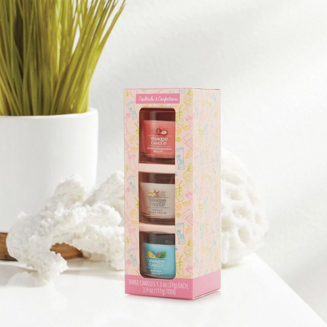 'Cocktails & Confections' mini candle set by Yankee Candle®, featuring White Strawberry Bellini, Vanilla Crème Brûlée, and Bahama Breeze™ in glass jars