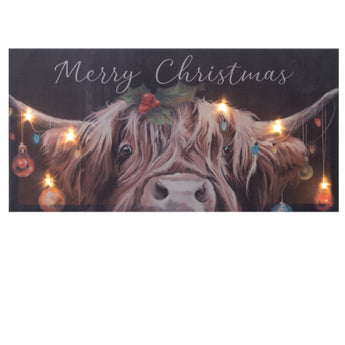 Merry Christmas cow light-up plaque with festive LED lights and ornaments from Chivilla Bay.