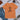 Orange t-shirt with a witch hat and broom graphic and text on a concrete surface with jeans, shoes, and accessories.