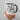 Person holding a mug with text 'I want you to know that someone cares. Not me, but someone.'