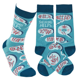 Colorful blue crew socks with hand-illustrated swearing word bubbles and 'Swearing helps' sentiment.