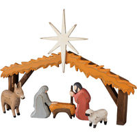 Small navtivity manger scene made from wood with 4 pieces including a sheep, a donkey, Mary and Joseph, and stable frame with star