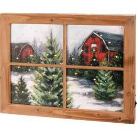 Rustic LED Christmas Wall Decor featuring a winter scene of a Red Barn with a faux window frame. 