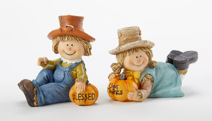 Blessed pumpkin with boy scarecrow and Give Thanks pumpkin with girl scarecrow figurines for table top decorating or adorning your book shelves