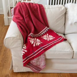 Rustic Nordic inspired thick cotton knit blanket with snowflake and varying patterned design