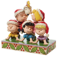 Charlie Brown, Snoopy and the Peanuts Characters together again in a holiday pyramid stacked with friendship figurine by Jim Shore for Enesco