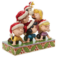 Charlie Brown, Snoopy and the Peanuts Characters together again in a holiday pyramid stacked with friendship figurine by Jim Shore for Enesco