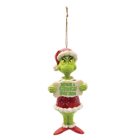 Grinch in a santa suit holding a beware a grinch lives here sign Christmas ornament for the Dr. Seuss Collection by Jim Shore for Enesco.