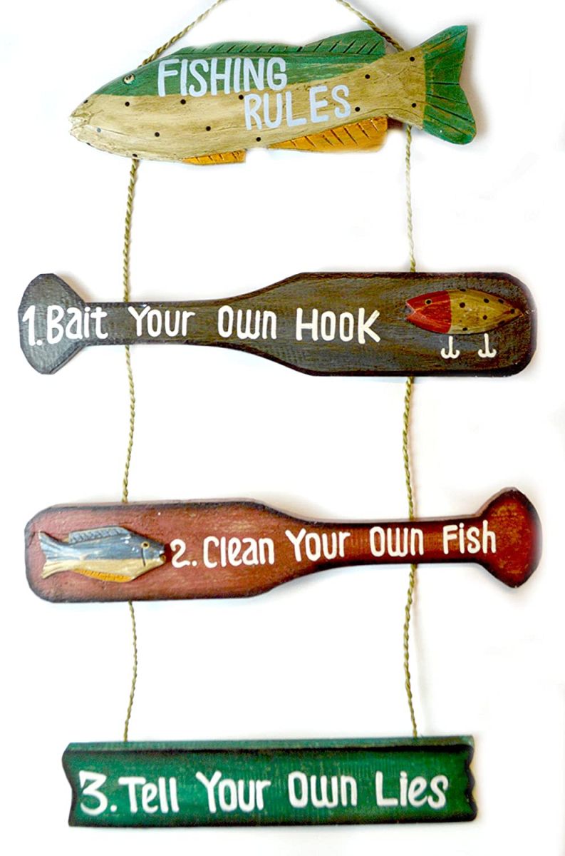 Fishing rules with wooden fish and 2  paddles, with three rules of fishing: bait your own hook, clean your own fish, and tell your own lies.