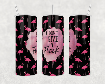 Funny Flamingo Drink Tumbler with a I don't give a Flock saying with flamingos on black background. 20 oz stainless steel skinny coffee tumbler with clear sliding lid and straw.