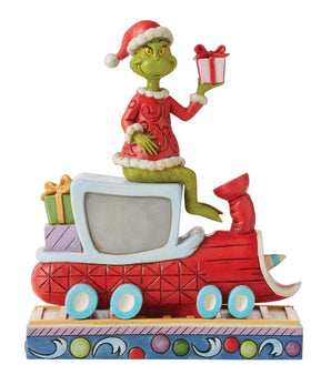 Jim Shore Grinch figurine riding red train returning presents Dr. Seuss Christmas collectible