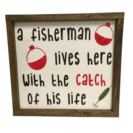 A fisherman lives here with the catch of his life handpainted wood home decor sign for cabin, man cave or rustic decor.
