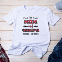I have two titles mom and grandma and I rock them both white short sleeve tshirt